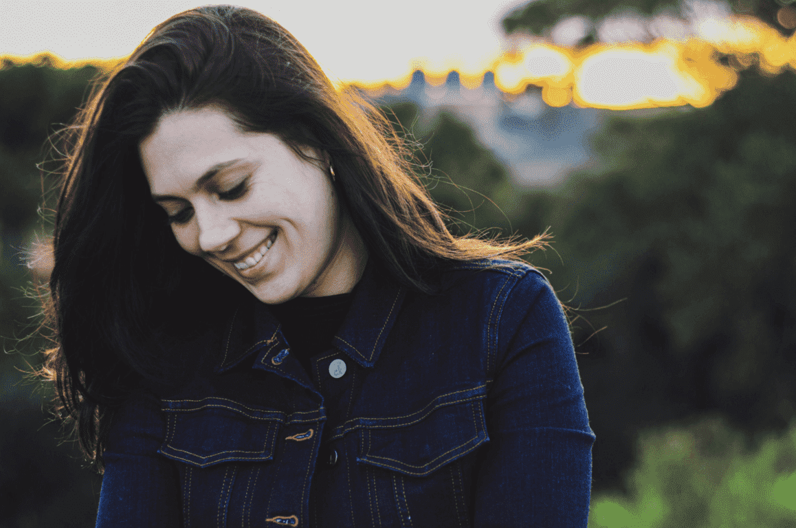 Woman smiling while looking down