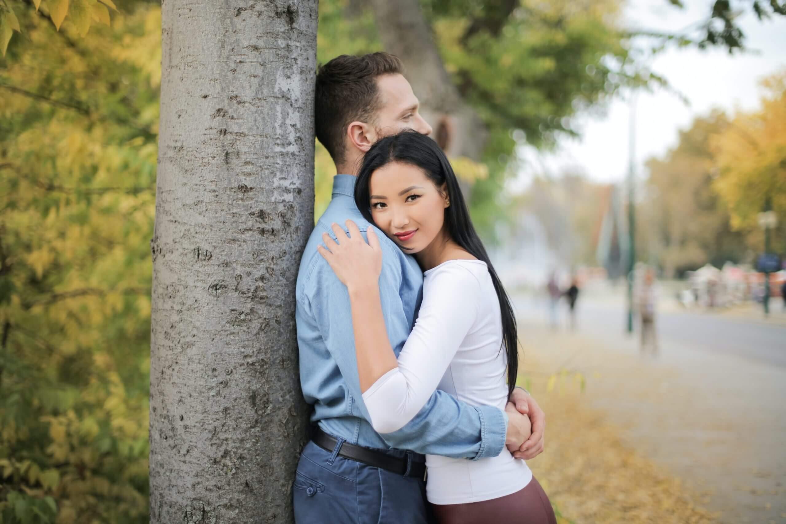 Couple hugging each other at the park
